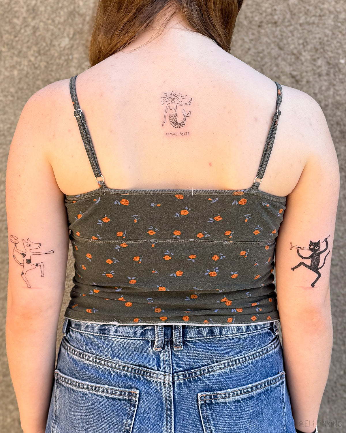 Three tattoos across the back of both arms and the upper back, done in a single session