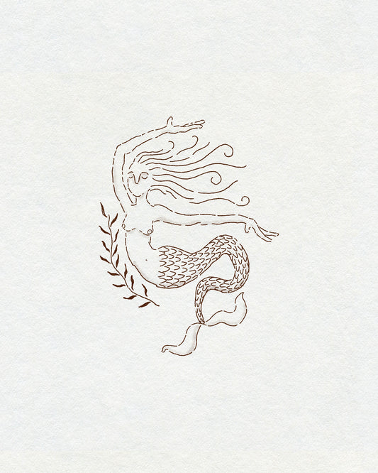 A sketch-style delicate fineline mermaid in brown ink with a plant next to her. On cream textured background.